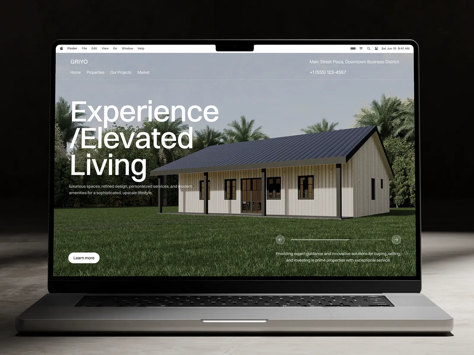 Elevated Living real estate website on a laptop